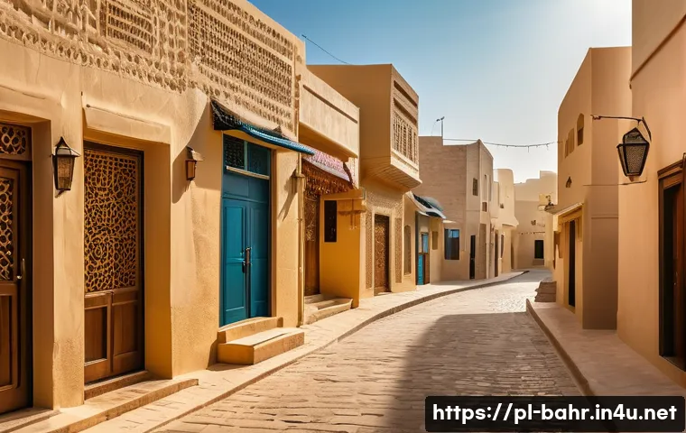 바레인 소도시 탐방 - A narrow, winding street in a traditional Bahraini village, paved with stone and lined by low, simpl...